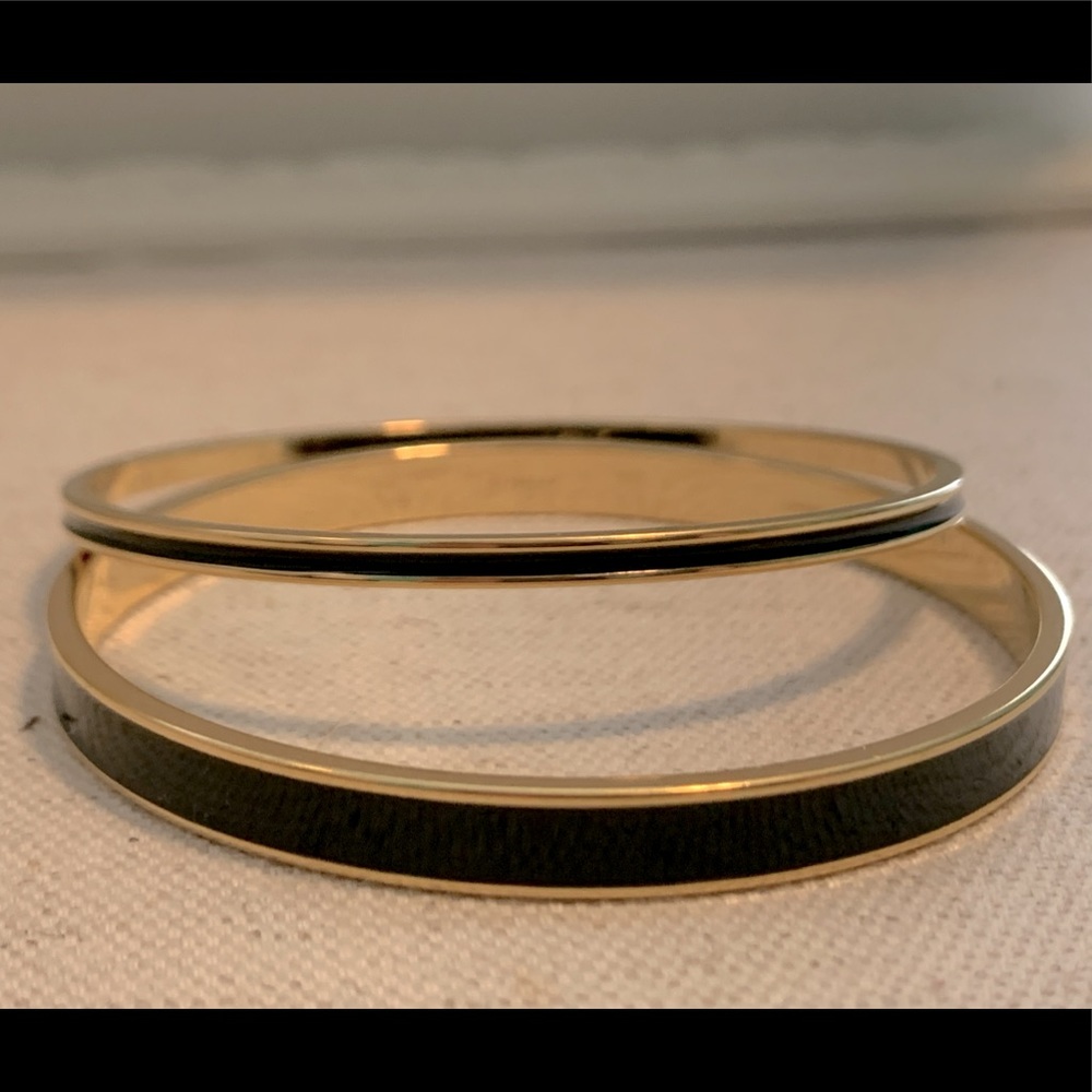 Two black enamel and gold town Monet enamel bracelets